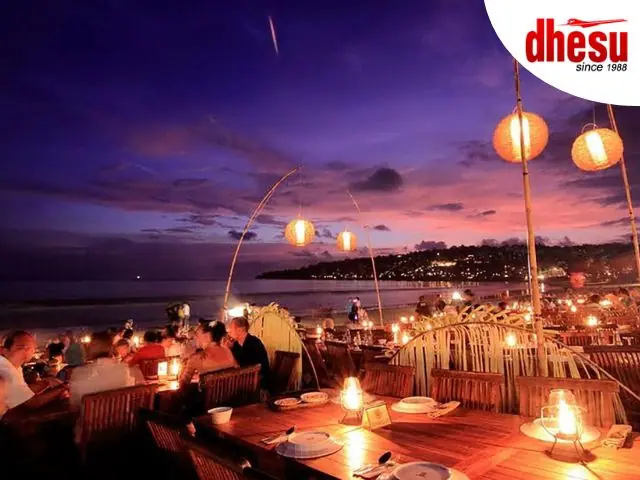 Beachside BBQ seafood dinner at Jimbaran Bay with sunset views, Bali