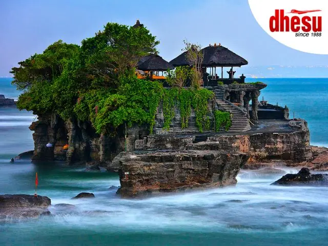 Tanah Lot sea temple silhouetted against a dramatic sunset sky, Bali