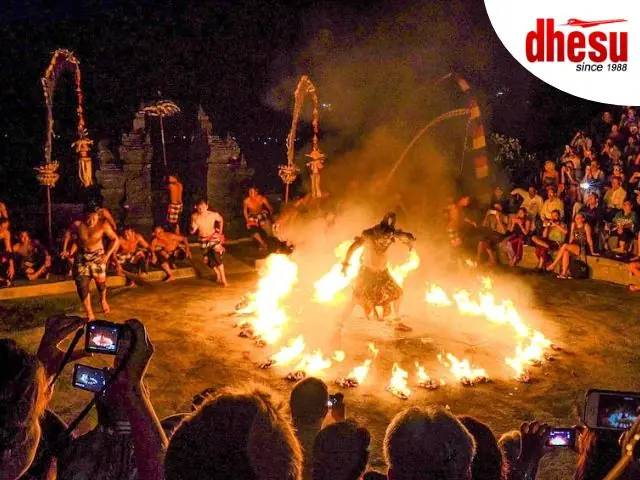 Kecak Fire Dance performers at Uluwatu Temple cliff at sunset in Bali